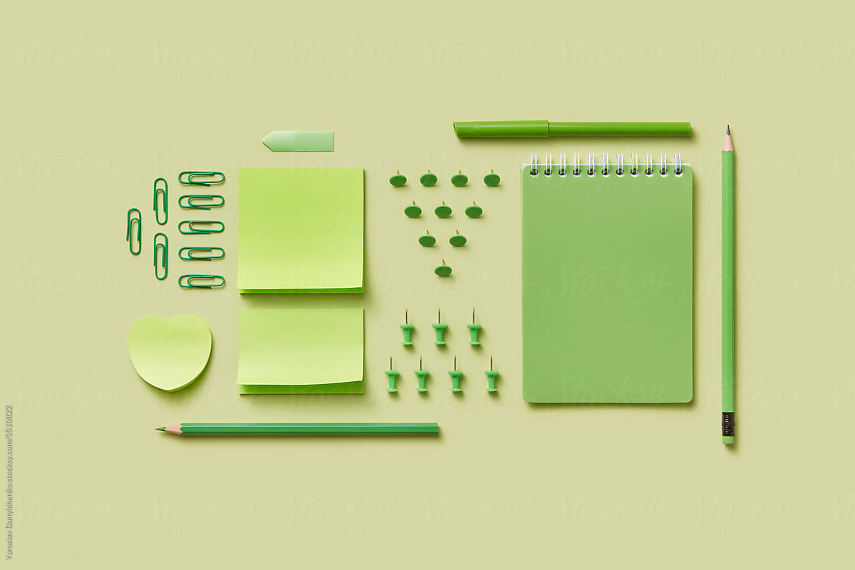 Bright green colored composition with various stationery.