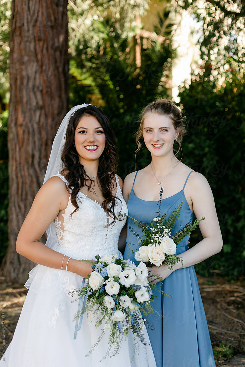 Blond Bridesmaid in Blue Dress and Bride