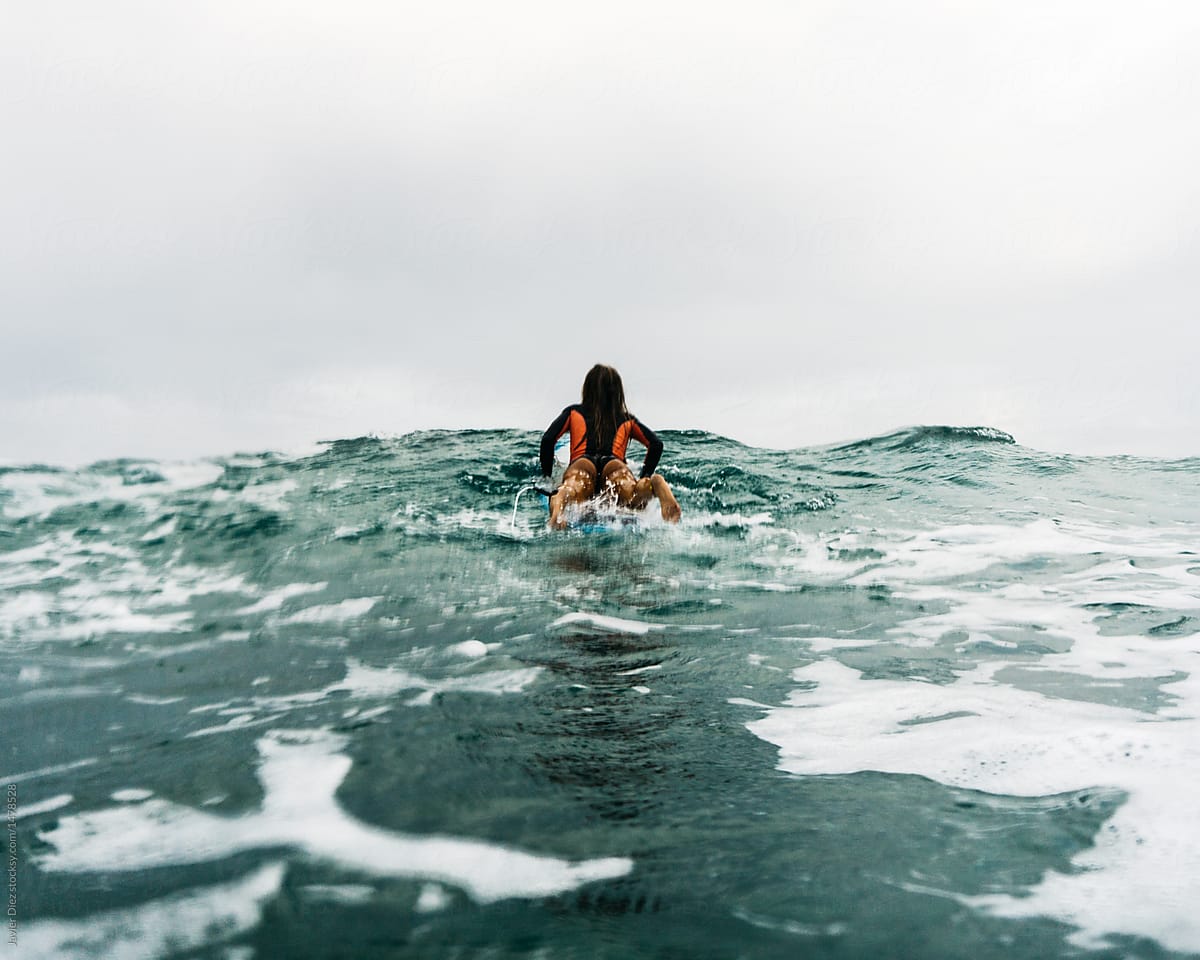 Girl on waves surfing