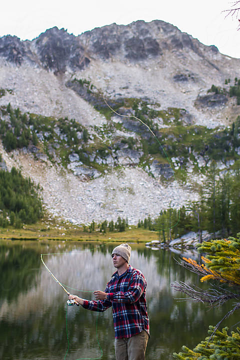 Woman Fly-fishing The Salt River During Sunrise by Stocksy Contributor  Hannah Dewey - Stocksy