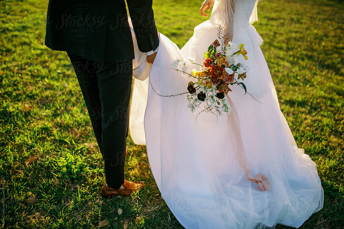 Bride Holding Bouquet And Groom Walking Away Bottom