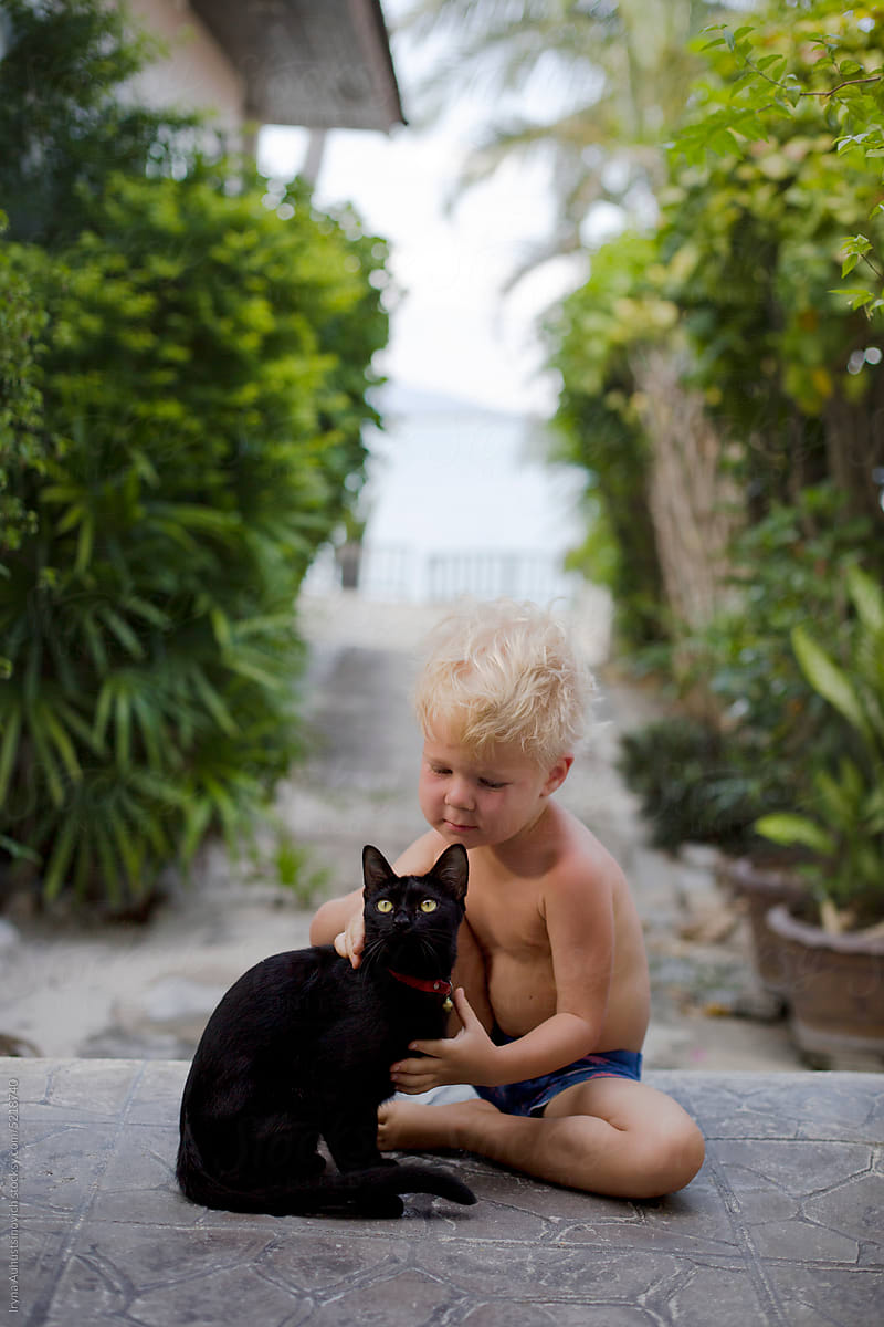 boy with black cat
