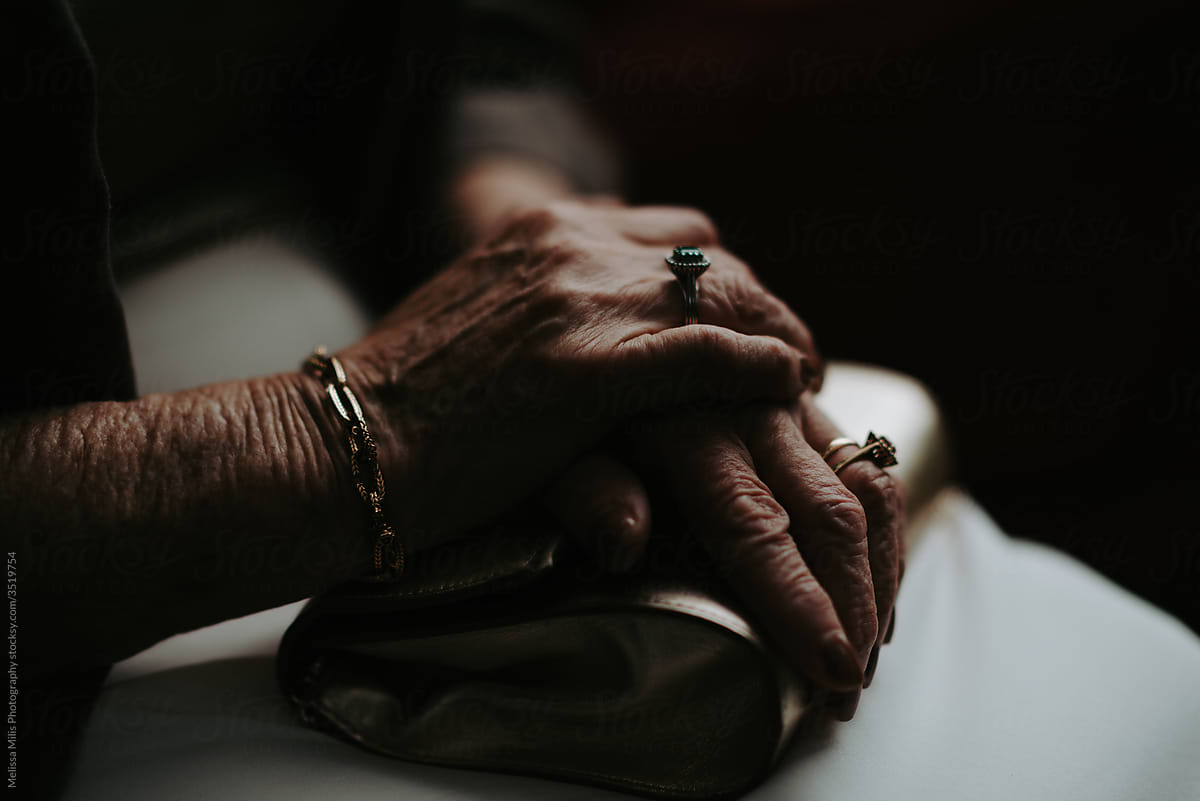 Older aged woman with hands on top of each other