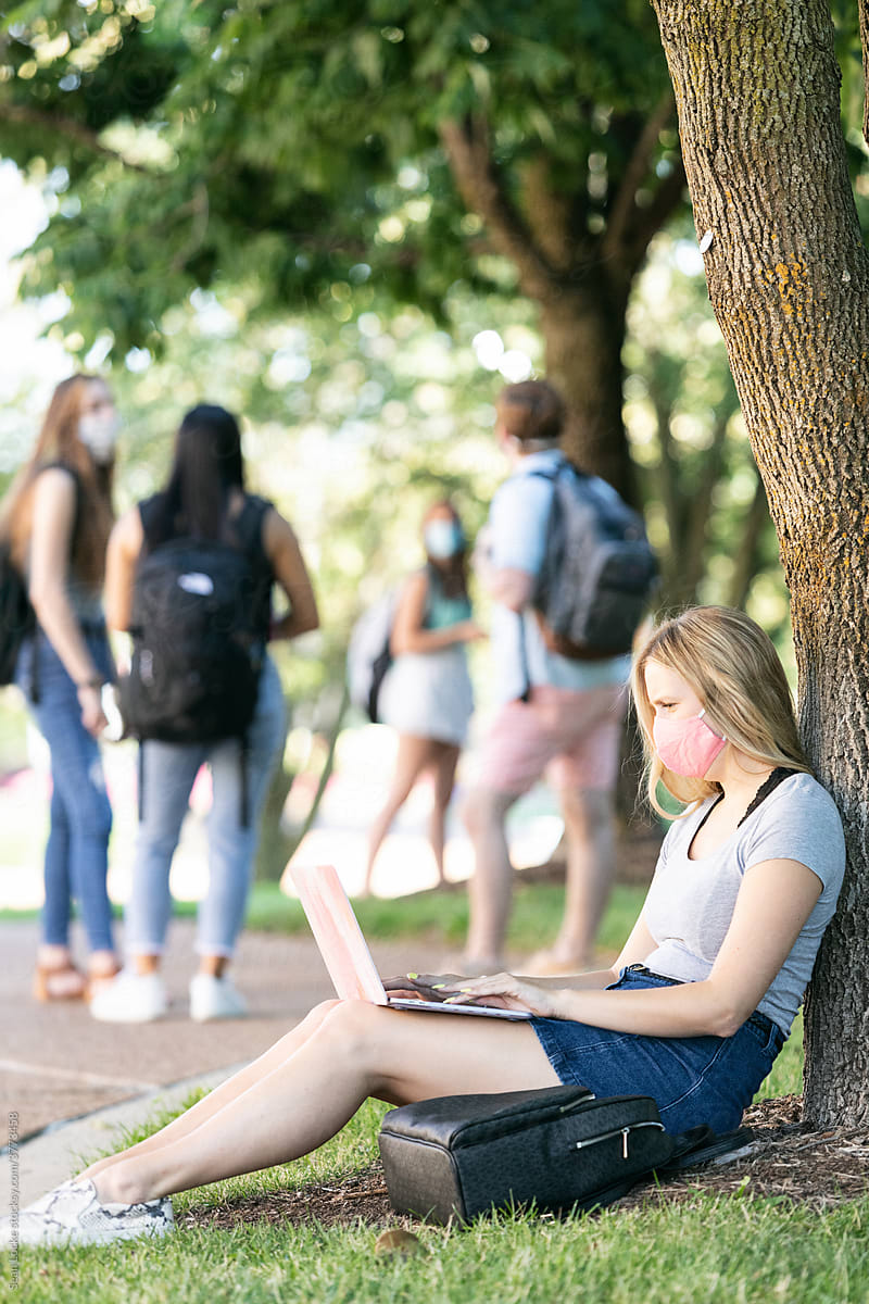 Covid: Student Sits Against Tree Taking Virtual Class