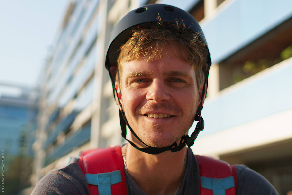 Portrait Of Young Delivery Man Smiling