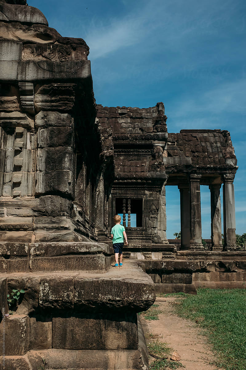 A little boy exploring Angkor Wat
