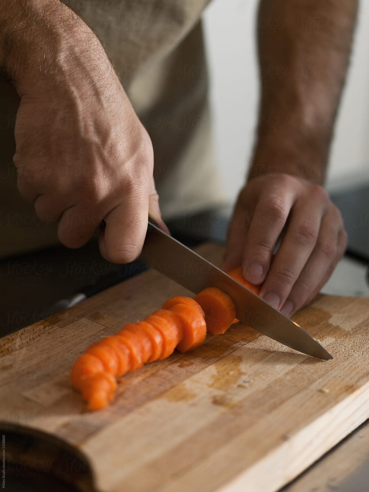 Hands Chopping The Carrot by Stocksy Contributor Milles Studio - Stocksy