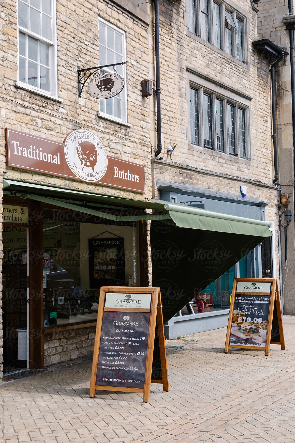 Butcher\'s shop with sandwich boards outside