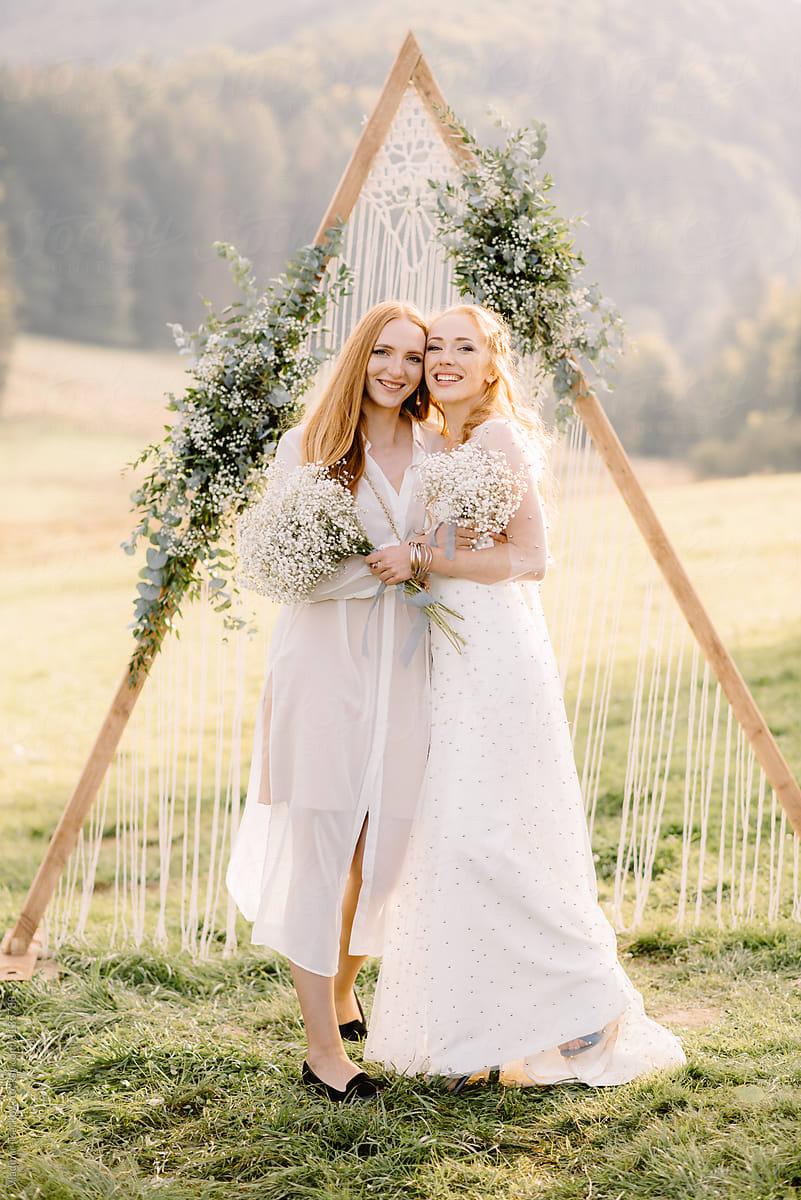 portrait of two female in wedding dresses