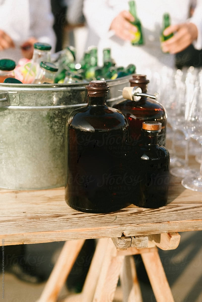 gin bottles and tonic in a big cold container, ready to be served