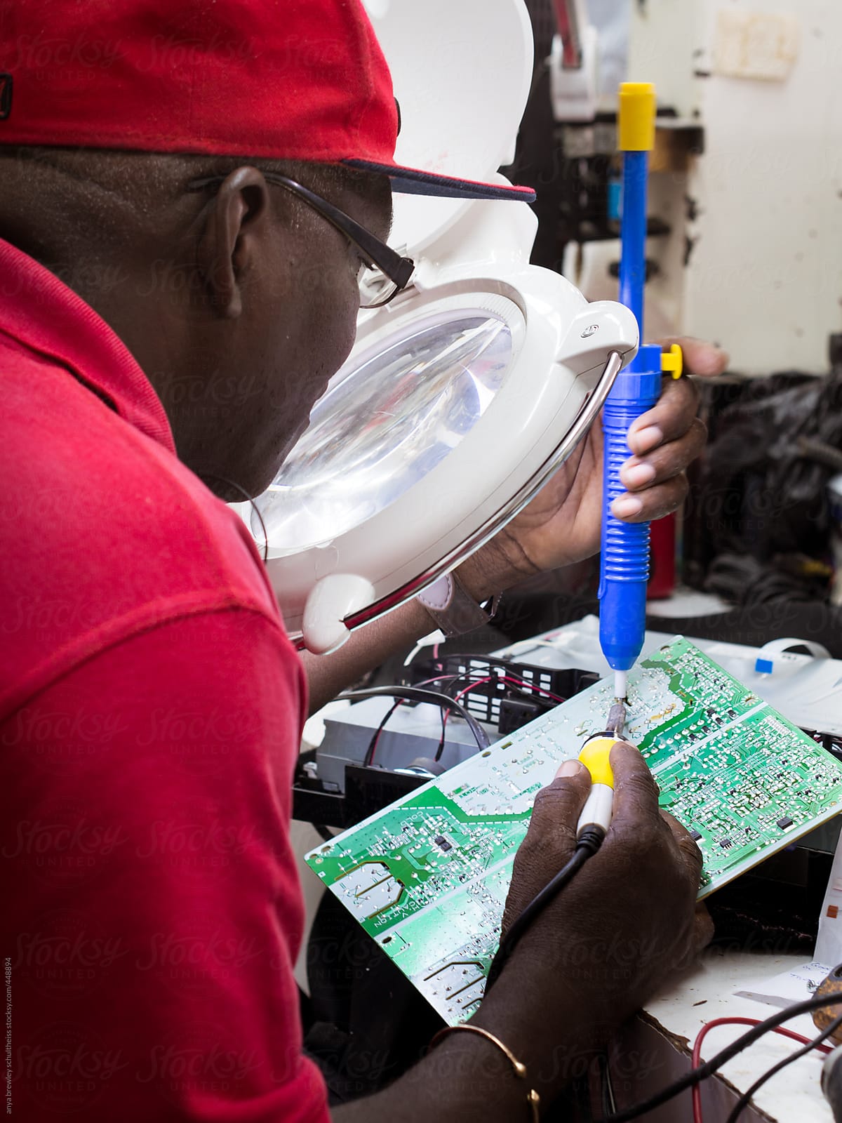 A male technician working on some electrical equipment