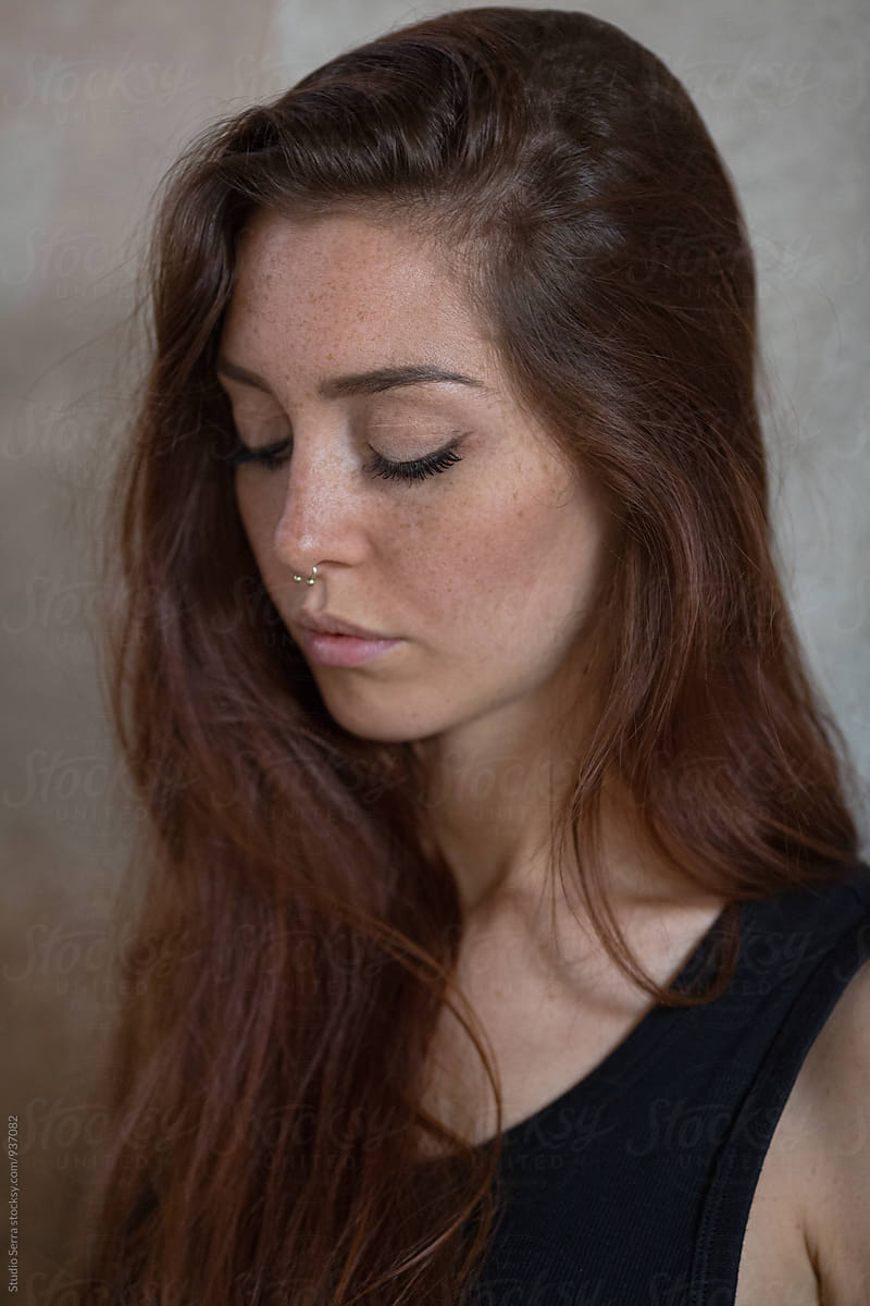 Close Up Of Freckled Woman With Eyes Closed By Alberto Bogo 