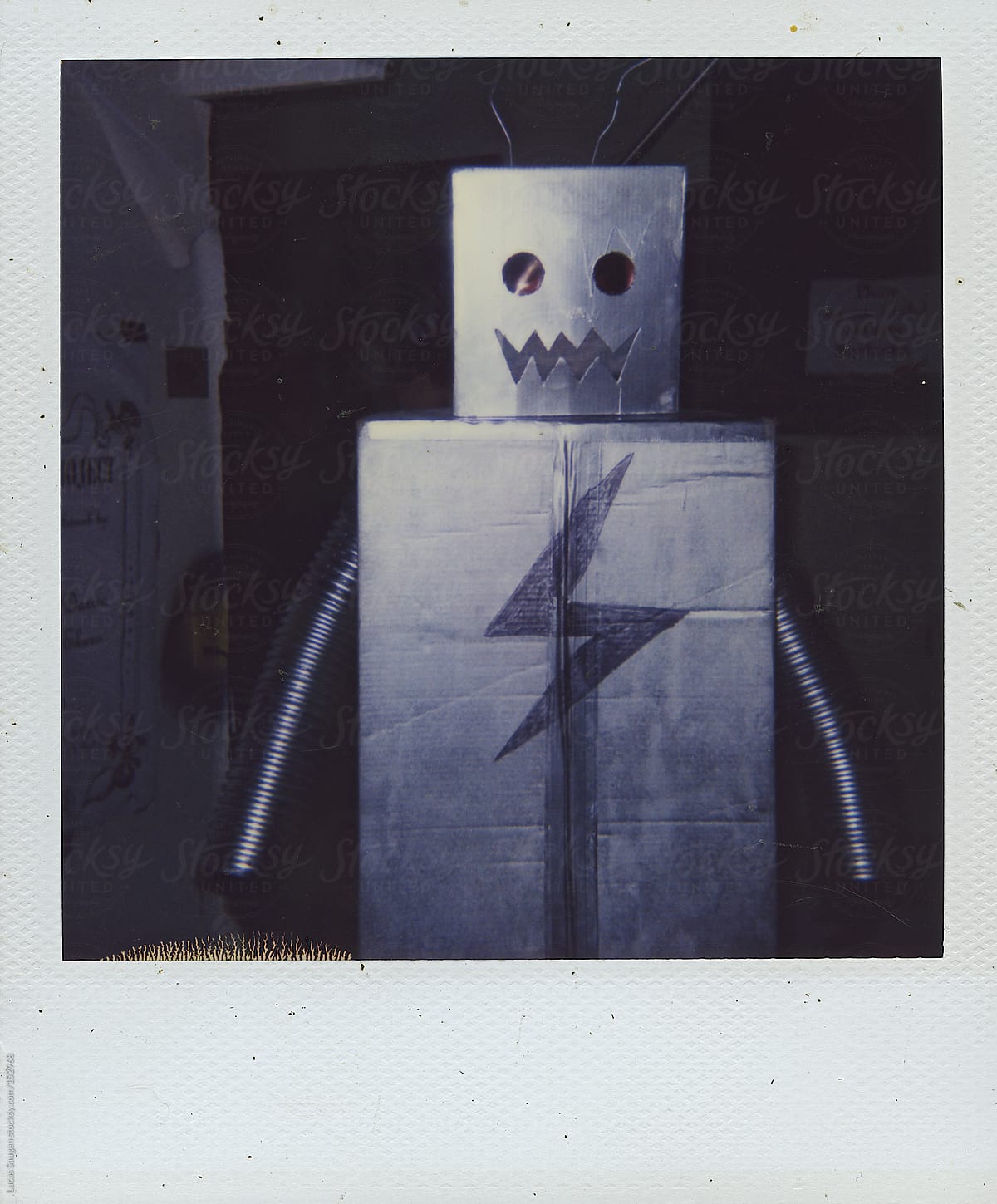 Polaroid of a guy in cardboard robot costume