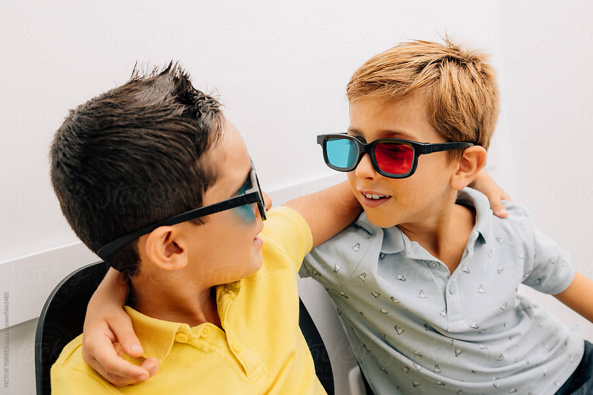 Cute children sitting with 3d red and blue eyeglasses