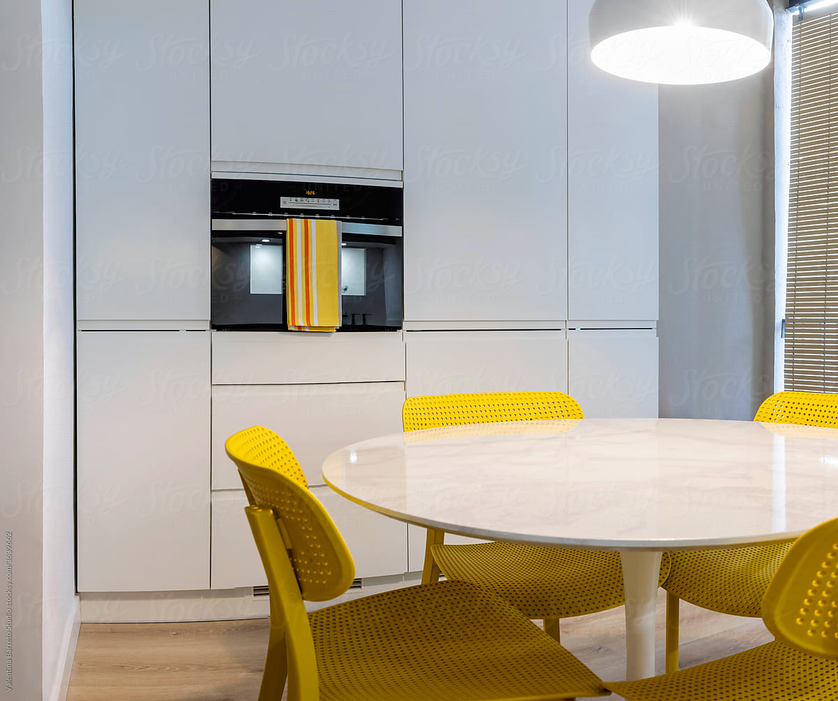 stylish Kitchen with yellow chairs