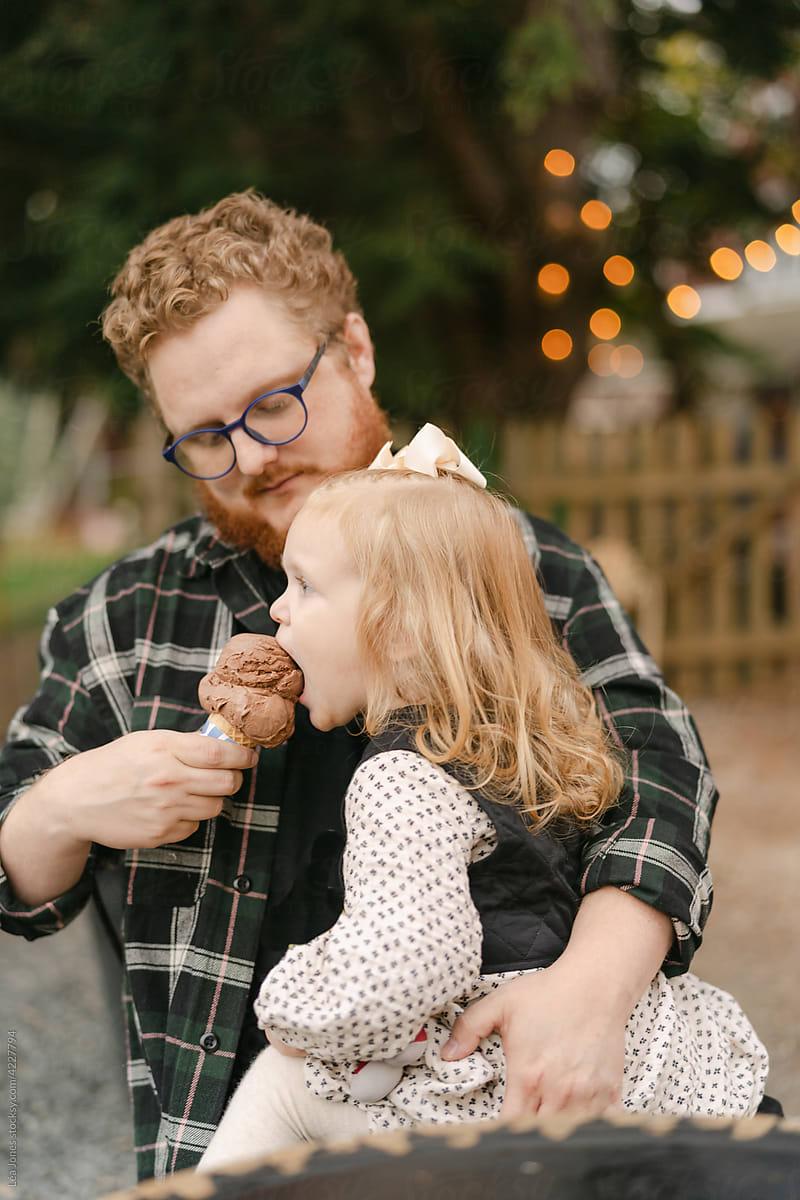 father and daughter eating ice cream