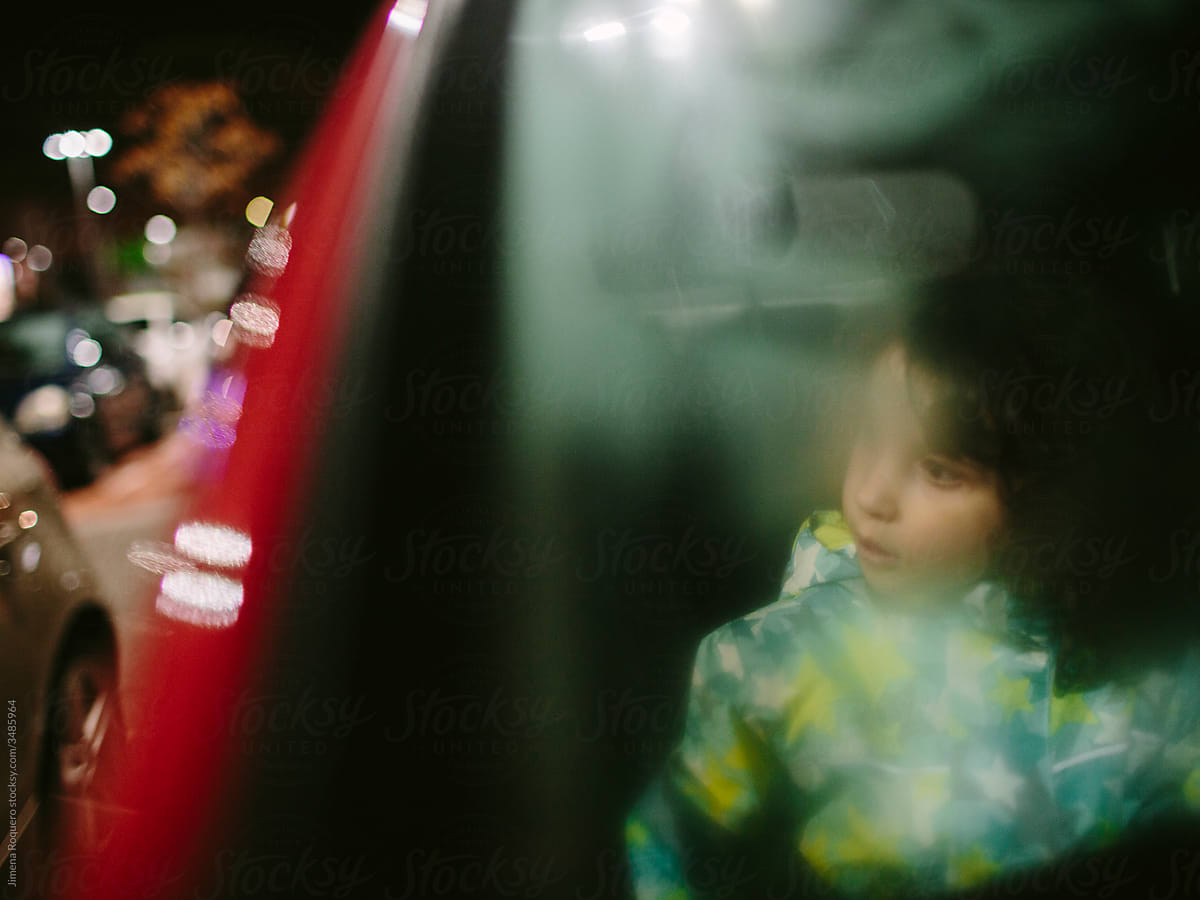 Kid and father inside a car with steamy windows