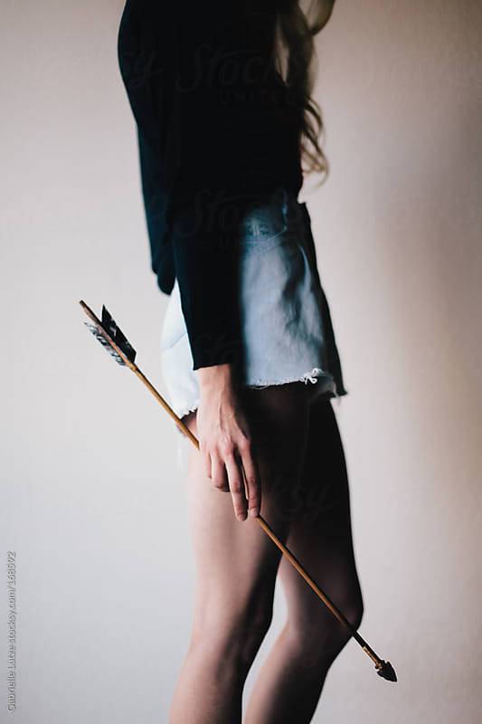 Woman Holding and Arrow - Cropped