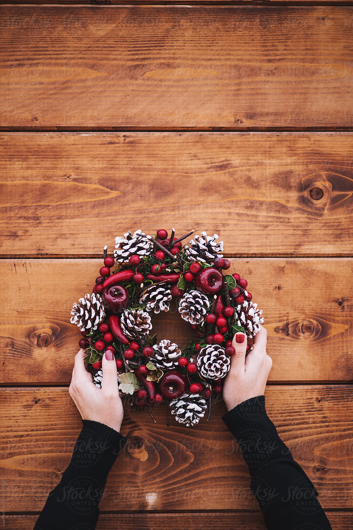 Woman\'s hands holding holiday decorations