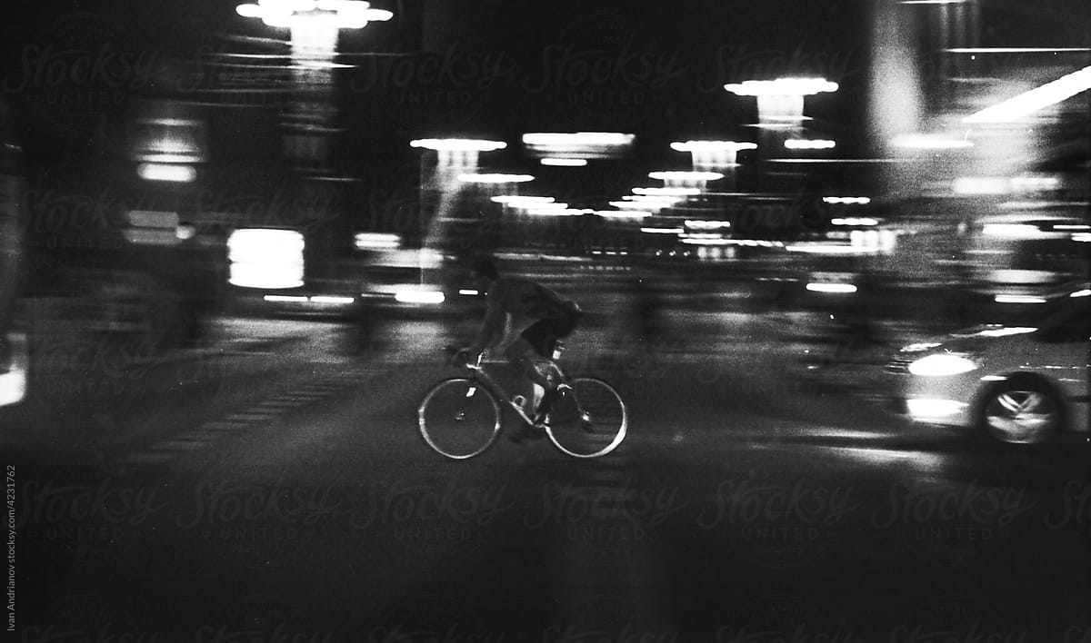 Man On A Road Bike At Night In The City