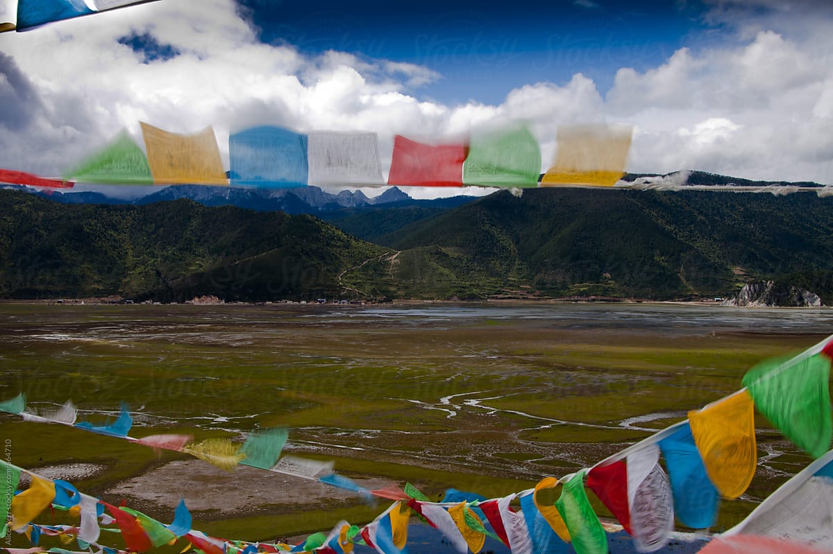 Buddhist prayer flags blowing by wind
