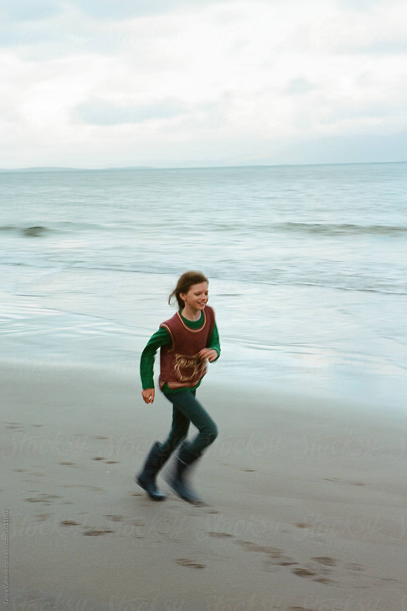 A running girl on the beach