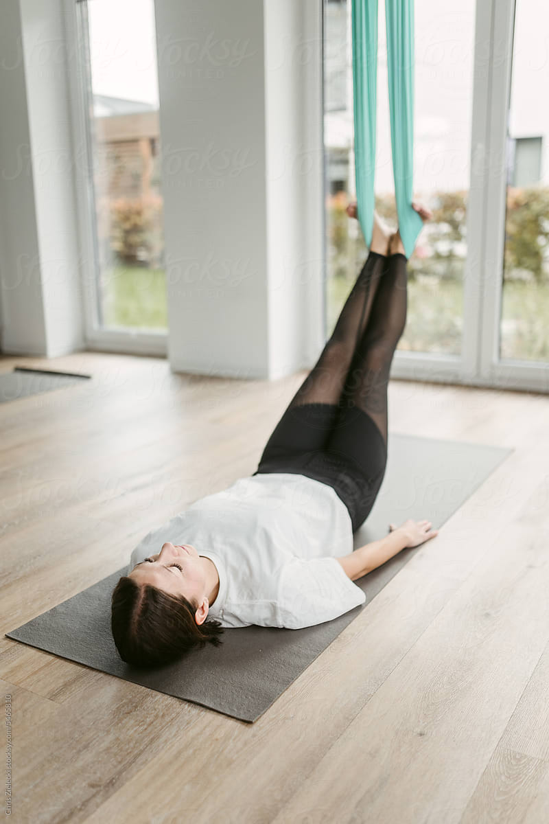 Young woman doing yoga training indoors