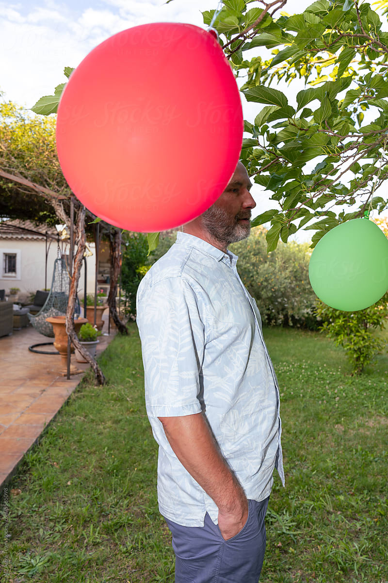 mature man with balloons