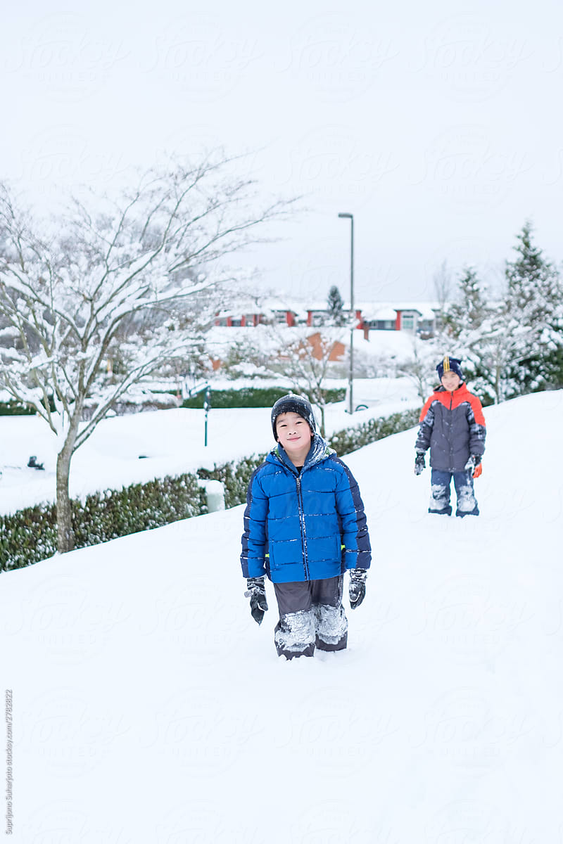 Asian Kids Standing on Deep Snow