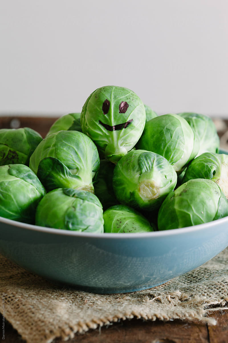 Smiley face on a Brussels sprout.