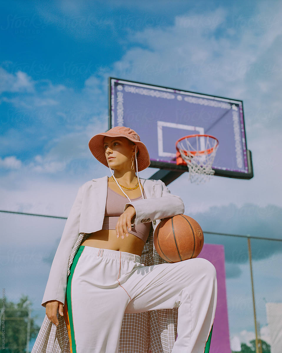 Analog Fashion Portrait of Hip Young Woman on Basketball Court