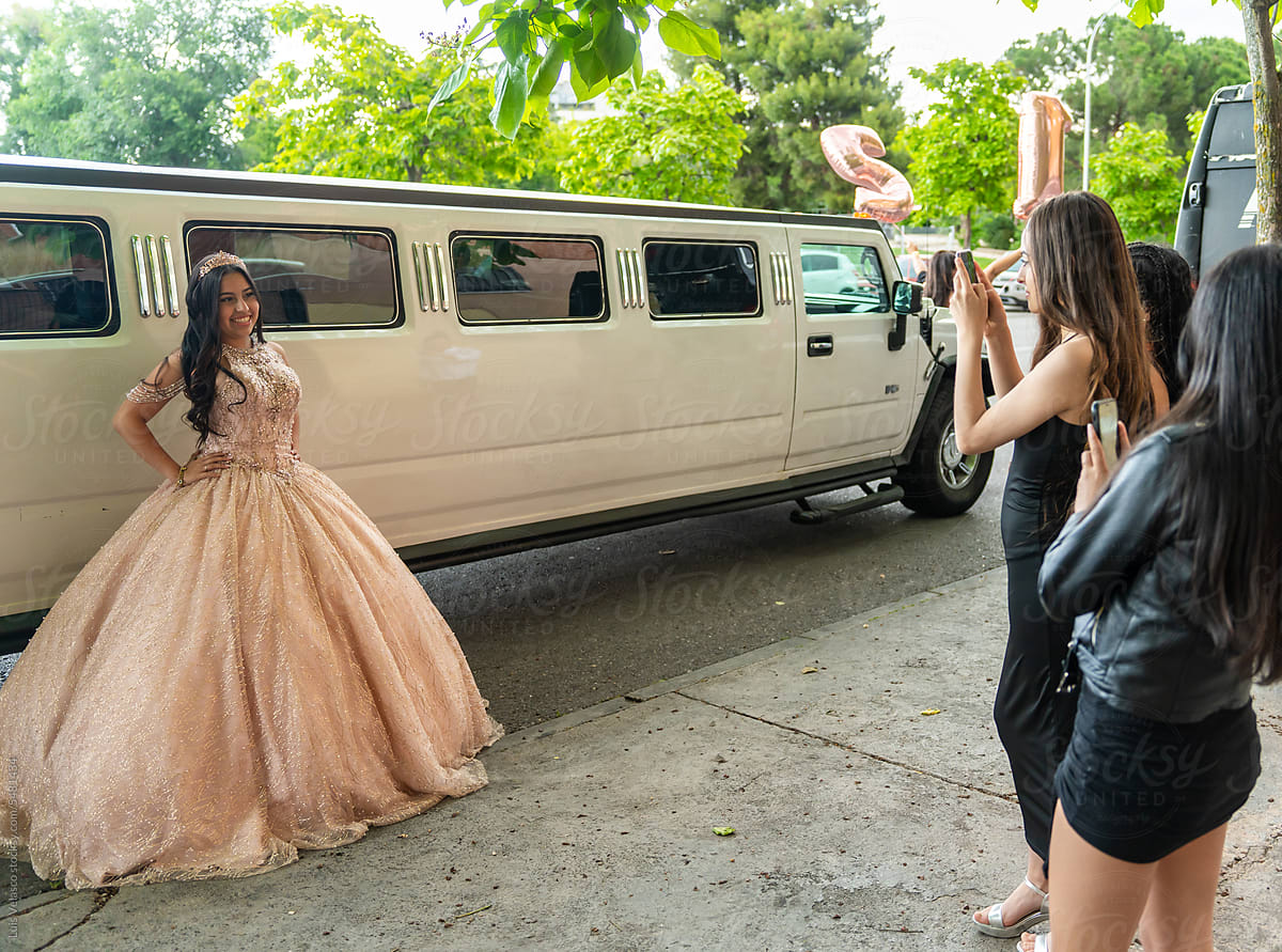 Portrait Of A 15th Birthday Party Next To A Limousine.