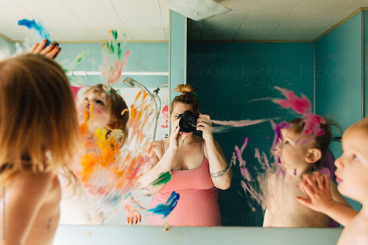 "Mother Taking Picture of Kids Painting On Bathroom Mirror" by Stocksy Contributor "Jessica Byrum"