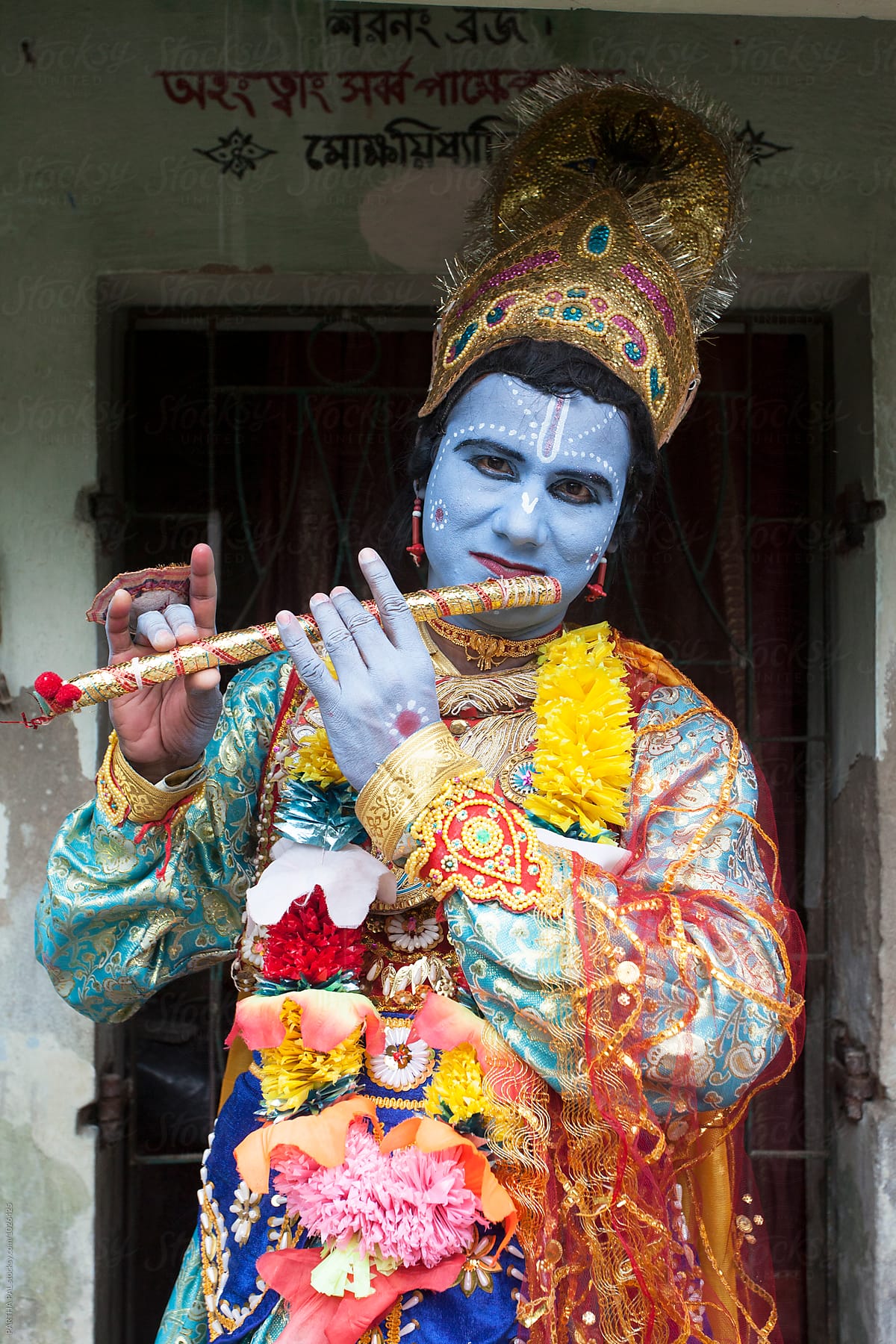 A BAHURUPI decorated himseld as Hindu God KRISHNA