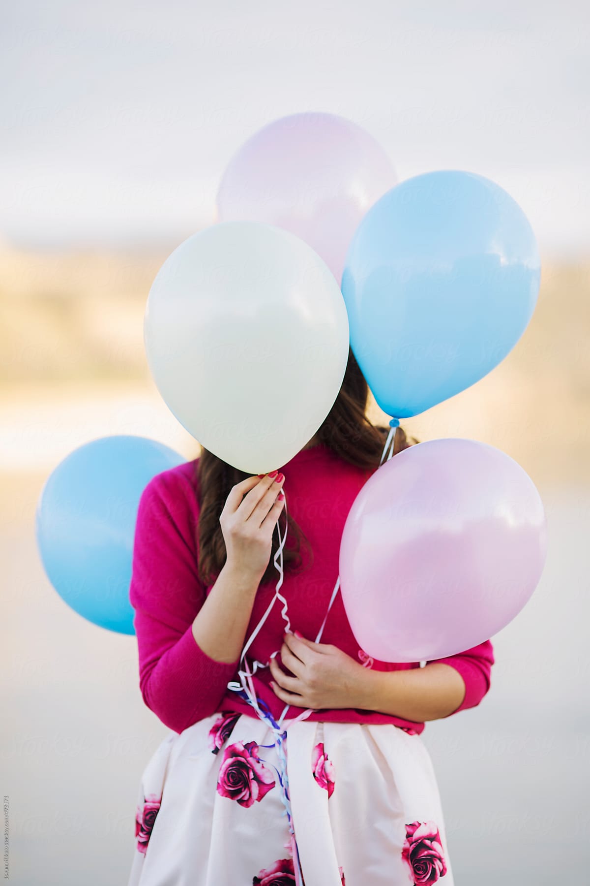 Young Woman Covering Her Face With Balloons By Stocksy Contributor Jovana Rikalo Stocksy 