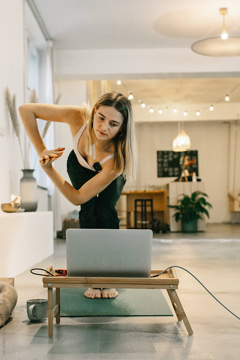 Young Woman Teaching Online Yoga Class