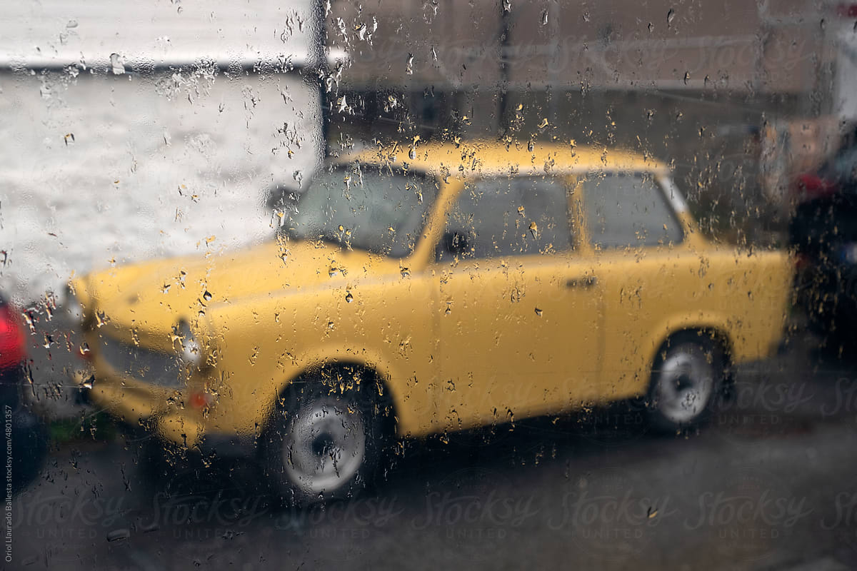 Views through the glass. Rainy day. A parked car