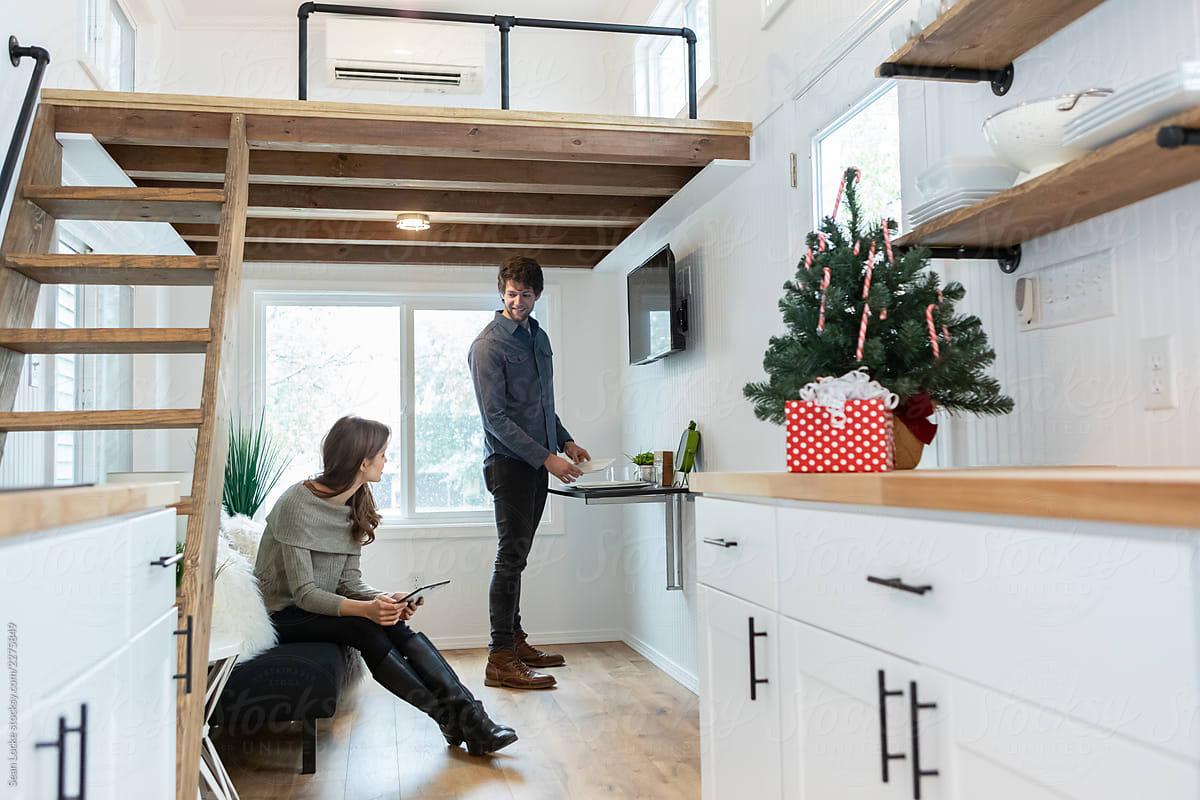 Home: Couple Relaxing During Christmas Season in Tiny Home