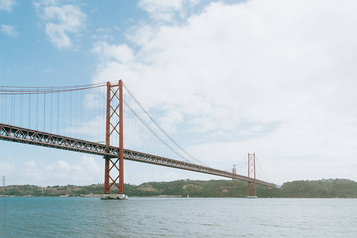 Iconic Red Bridge Over Lisbon Waters