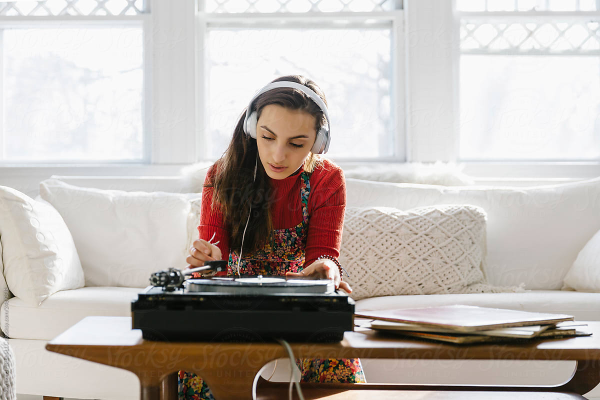 Teen Lifestyle image of Girl with Turntable seated on Couch