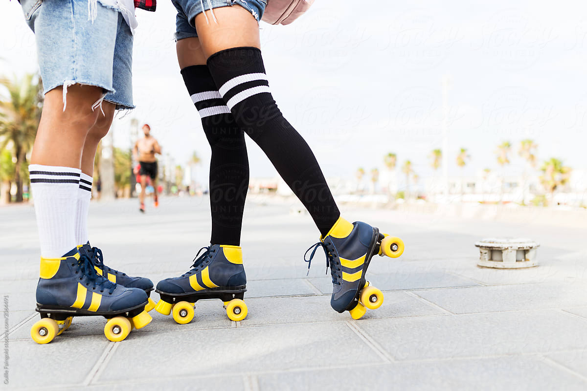 Romantic Couple\'s legs wearing roller skates