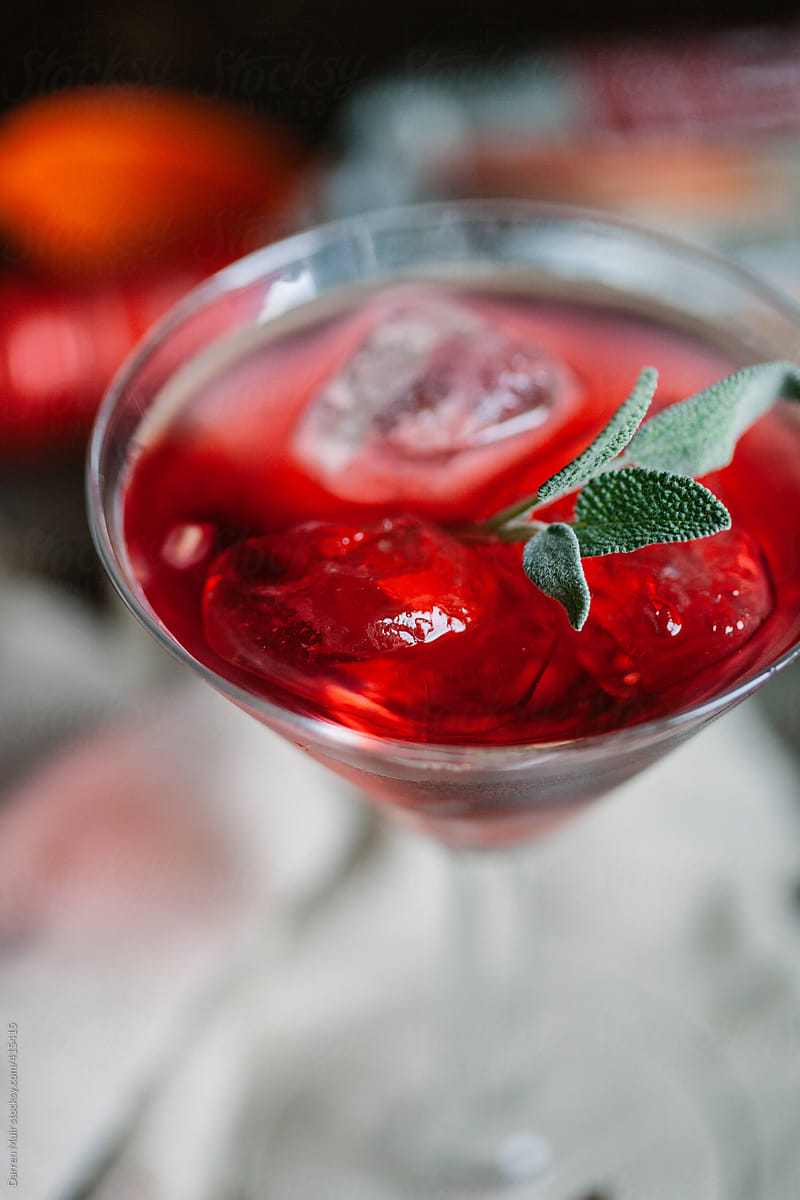 Closeup of cocktail with sage.
