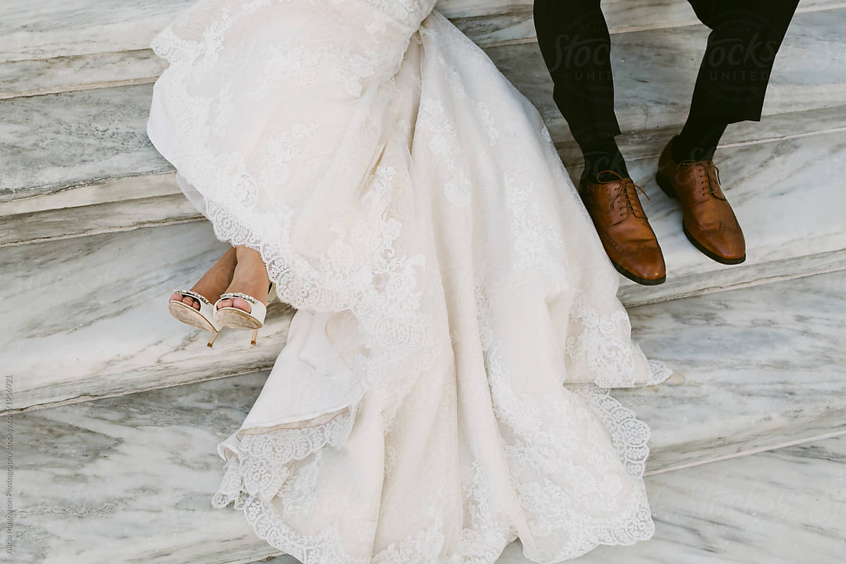 Bride and Groom Reclining on Steps