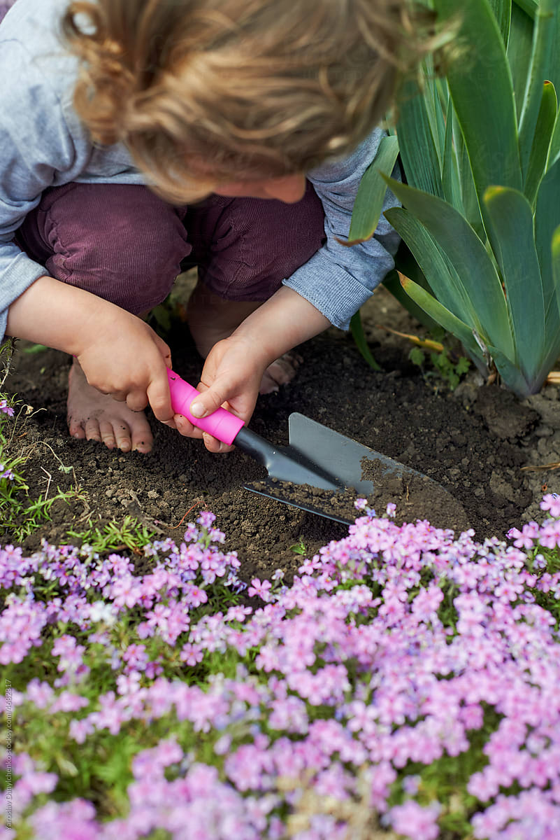 Child planting flowers
