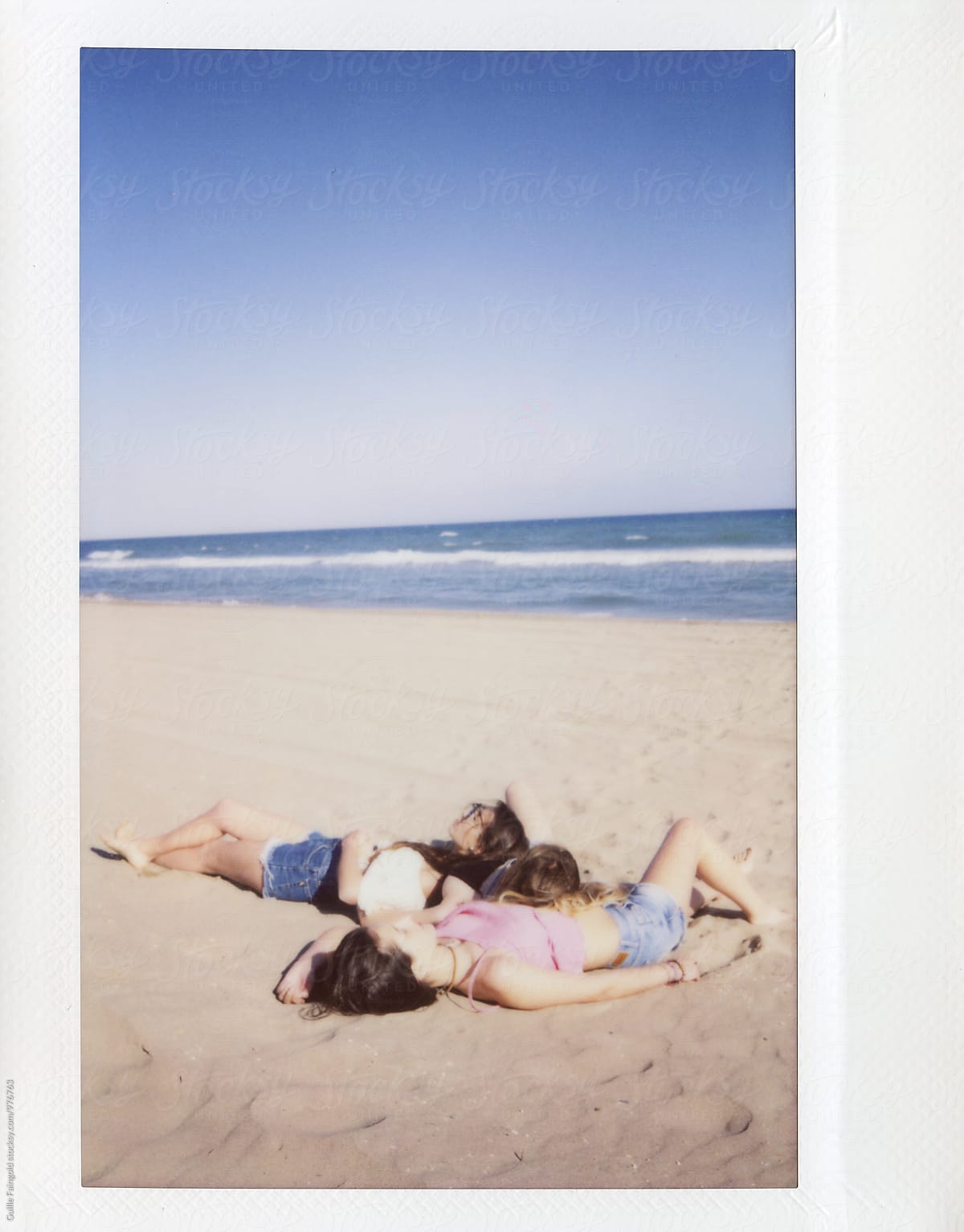 Girls Relaxing On Beach By Stocksy Contributor Guille Faingold Stocksy