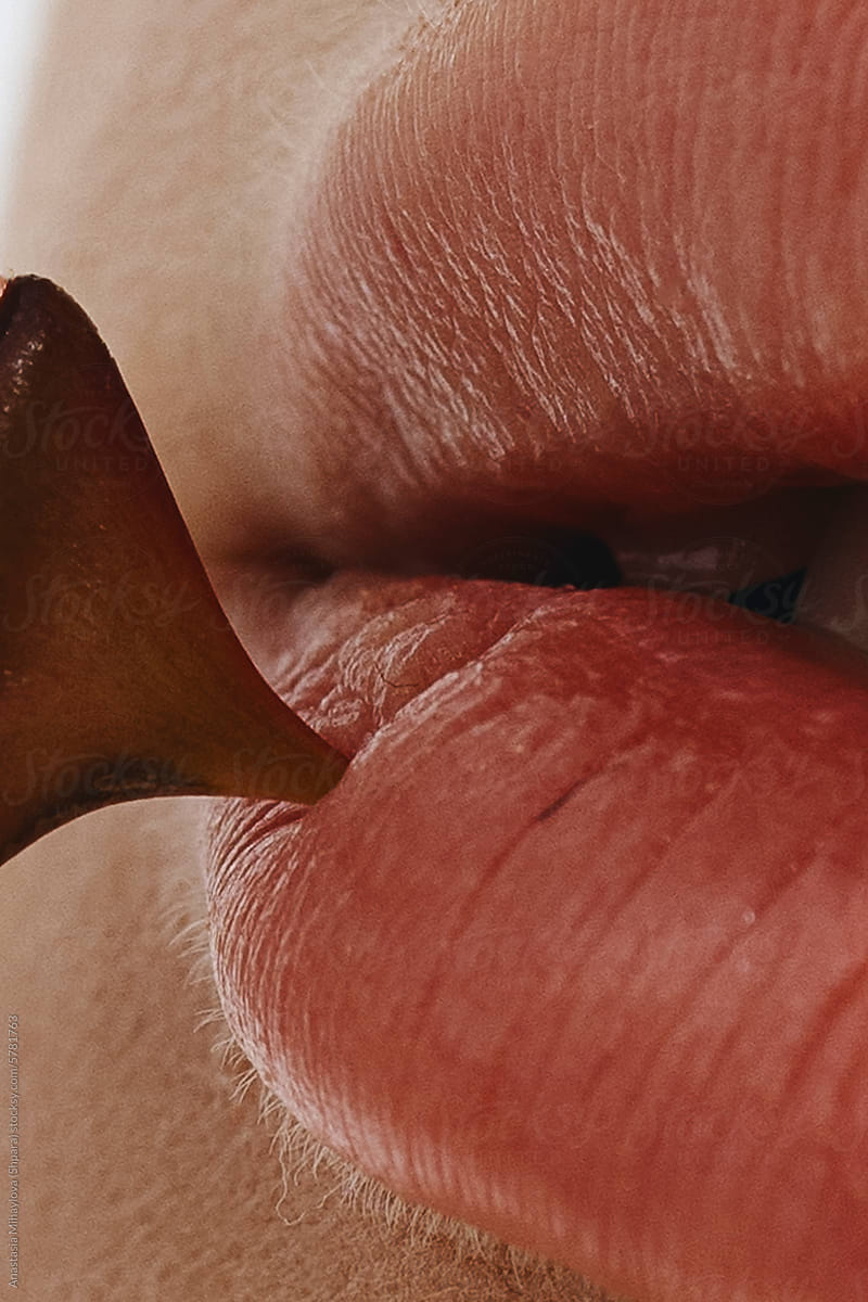 Close-up sensual woman\'s big plump lips of anonymous woman