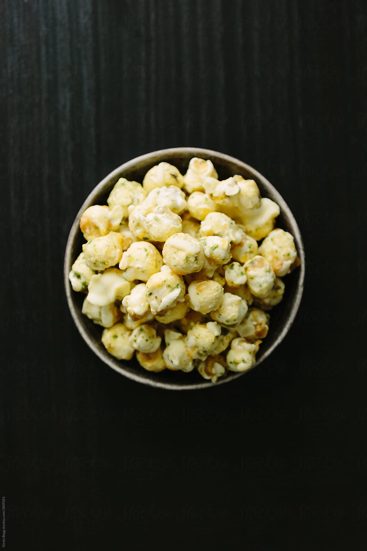 A small bowl of peppermint and white chocolate popcorn