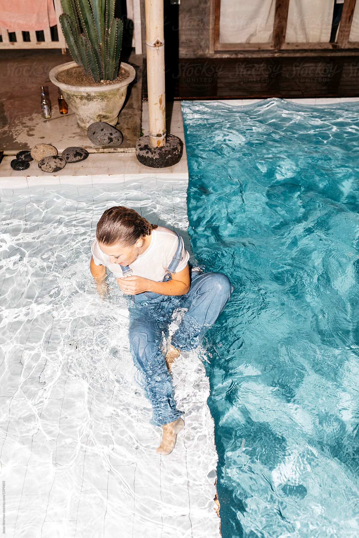 Young Woman Wearing All Her Clothes While Swimming In Pool During Night 876