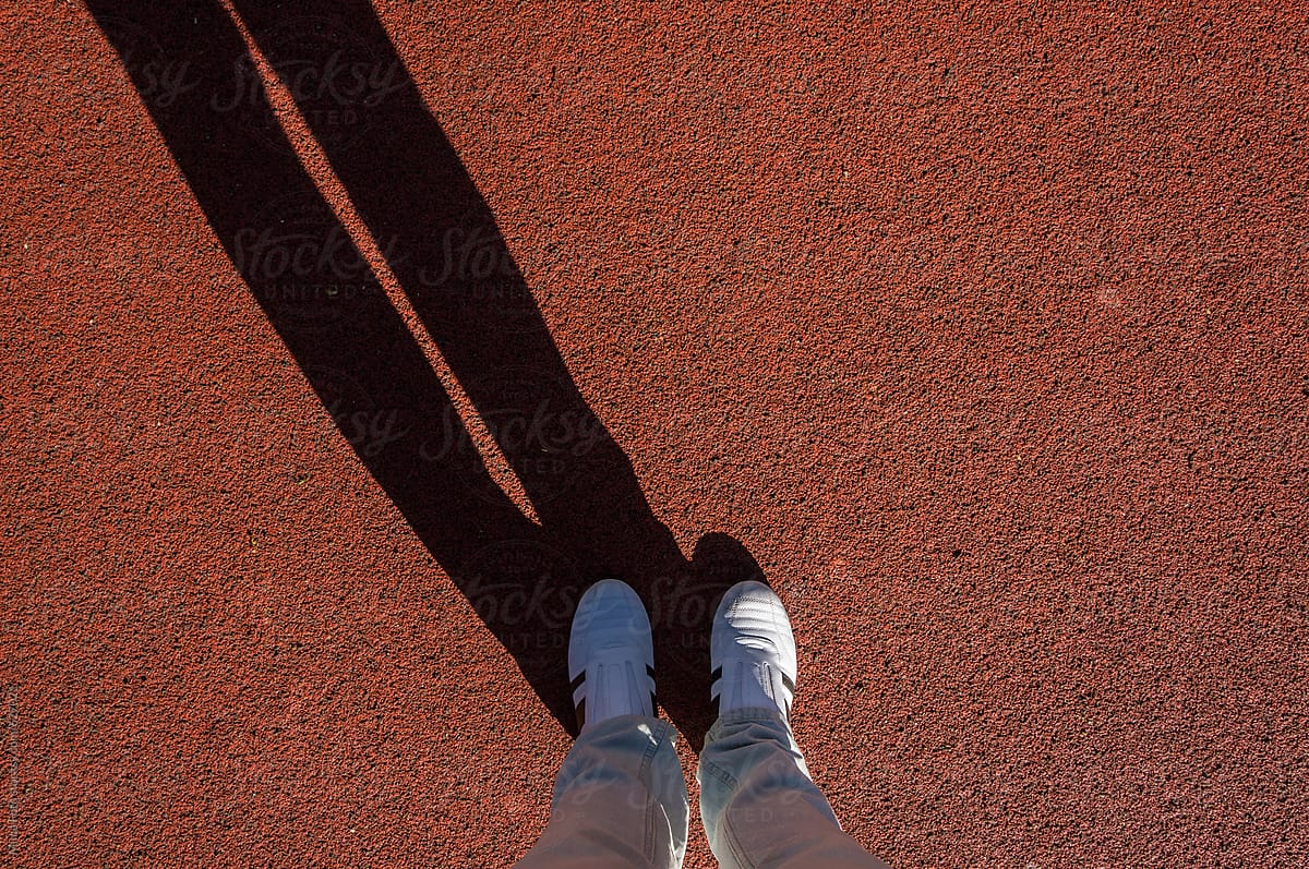 White sneakers, diagonal shadow, footsie, personal perspective