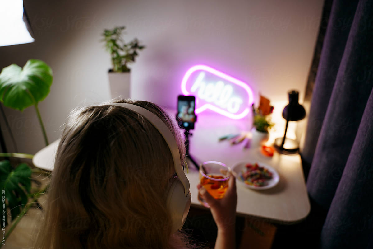 Teen girl using smartphone at night